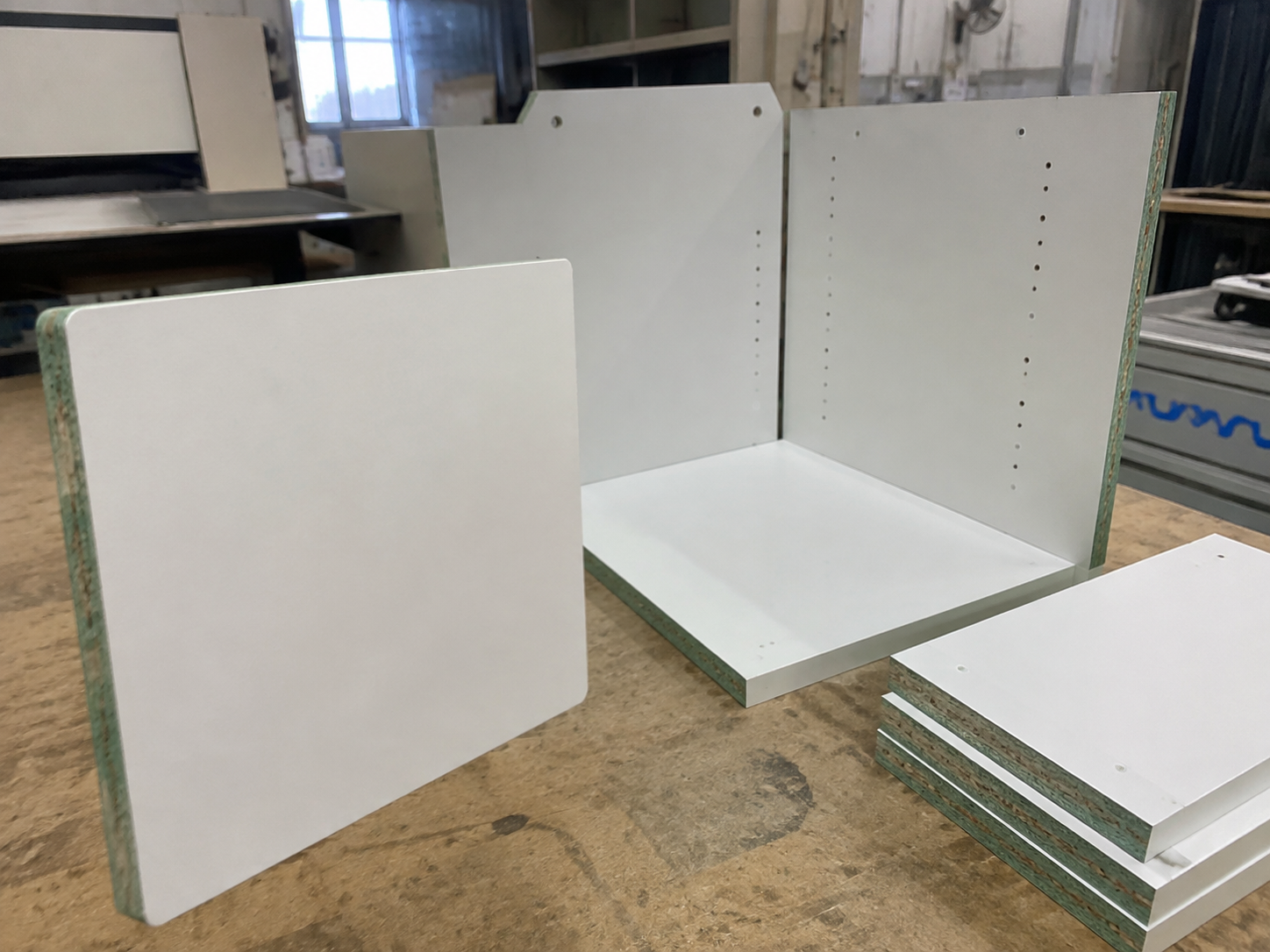 Moisture resistant particle board for kitchen cabinet carcasses